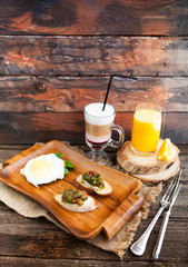 Latte Macchiato with Coffee Beans, Two eggs and bacon toasts and