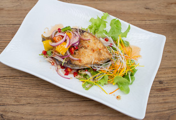 Fillet topped with a spicy dressing.