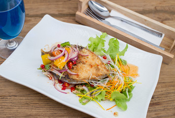 Fillet topped with a spicy dressing.