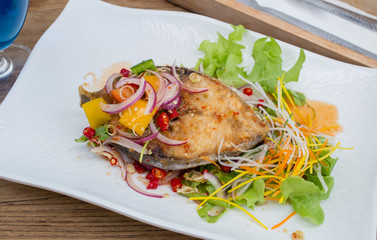 Fillet topped with a spicy dressing.