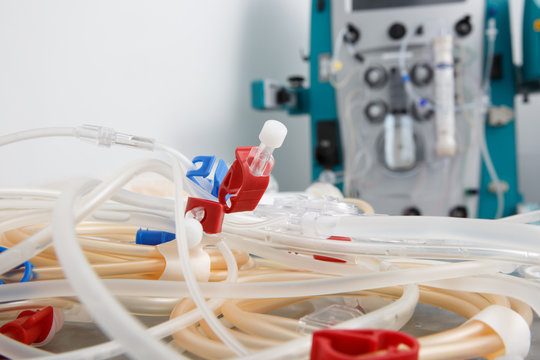 Blood tubes with hemodialysis machine in the background