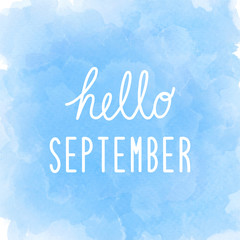 Hello September greeting on abstract blue watercolor background