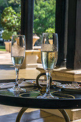 A refreshing glass of white wine on a bright sunny day
