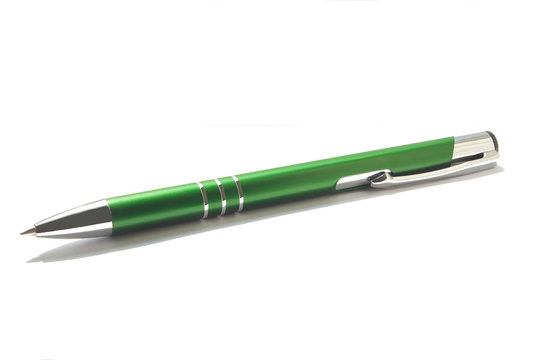Green ball-point pen over white