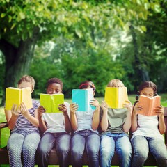 Composite image of children reading books at park