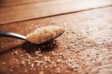 Sugar in a stainless spoon still life tone