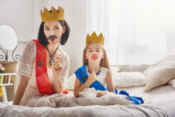 queen and princess in gold crowns