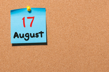 August 17th. Day 17 of month, color sticker calendar on notice board. Summer time. Empty space for text