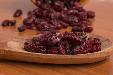 Dried Cranberries into a spoon