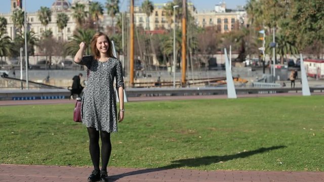 Young female demonstrate balley pa, have fun at embankment park