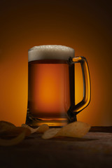 mug of beer and chips on the table