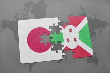 puzzle with the national flag of japan and burundi on a world map background.