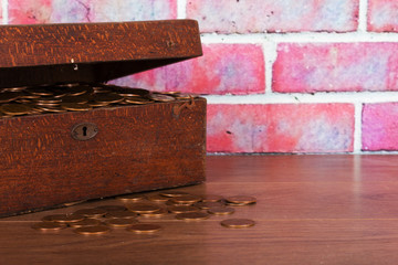 Wooden chest filled with old copper coins