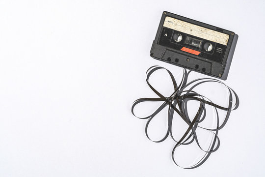 Old cassette tapes with copyspace on gray paper