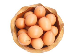 Top view of fresh home grown eggs in wooden bowl isolated on white background