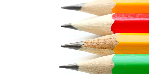 Wooden sharp pencils isolated on white background, closeup