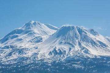 Gordijnen Snowcapped Mount Shasta volcano during winter blue closeup © Andriy Blokhin