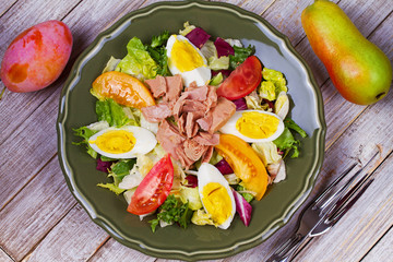 Tuna, egg and vegetable salad. View from above, top studio shot