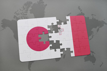 puzzle with the national flag of japan and malta on a world map background.