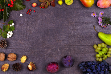 Grape, figs, plums, apples, pears, berries and leaves. View from above, top studio shot of fruits