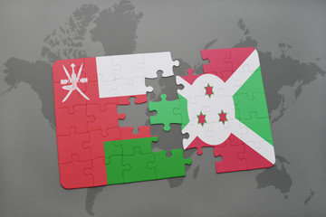 puzzle with the national flag of oman and burundi on a world map background.