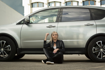 Fototapeta na wymiar Fashion woman near luxury car