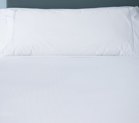 Fototapeta na wymiar Pillows on bed