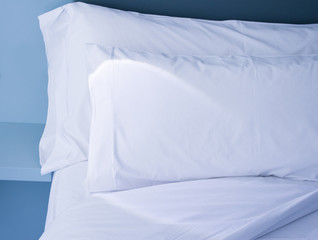 Fototapeta na wymiar Pillows on bed