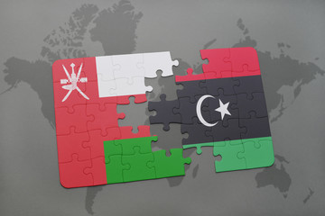 puzzle with the national flag of oman and libya on a world map background.