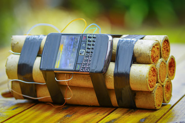 cellphone tied to a terrorist bomb laying on the ground