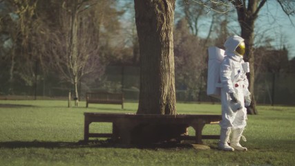  Sad astronaut lost in a park on earth