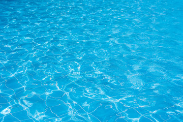 Fototapeta na wymiar Swimming pool with sunny reflections