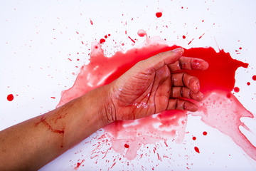 Bloody hand is smearing red blood on white background.Murder con