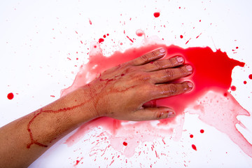 Bloody hand smearing red blood on white background.Murder concep