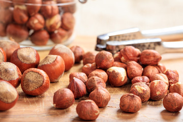 Hazelnuts and a nutcracker on a table