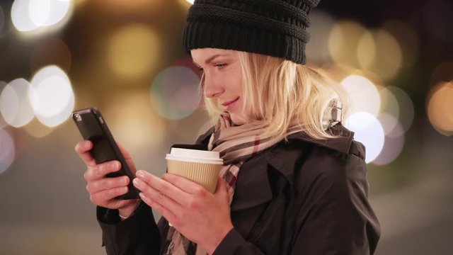 Woman using phone to get a rideshare