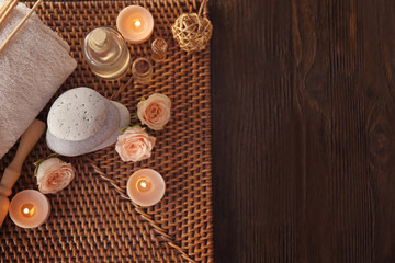 Beautiful spa composition with flowers on wooden background