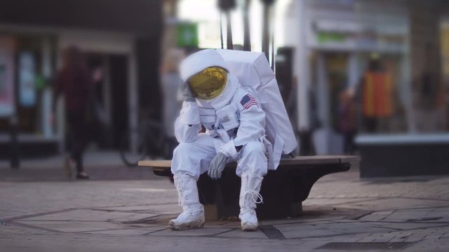  Sad astronaut lost in a city on earth