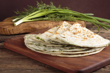 Scallion pancakes. Round unleavened flatbread minced green onion