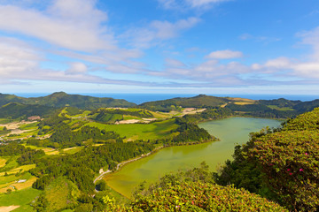 Panoramic view of Lagoa das Furnas, a lake in volcanic crater near Furnas in Azores, Portugal. Scenic view of agricultural area of Sao Miguel island.