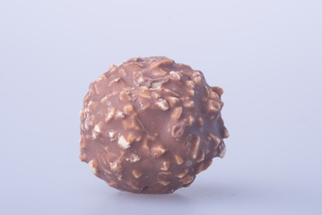 chocolate ball or chocolate bonbon on a background.