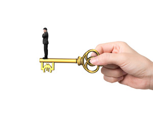 Man standing on treasure key in Euro sign shape