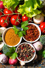 assortment of spices and fresh organic vegetables, vertical