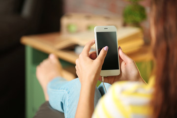 Girl listening to music with smart-phone
