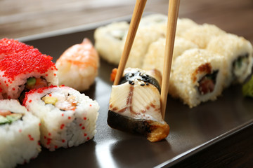 Delicious sushi set on ceramic plate