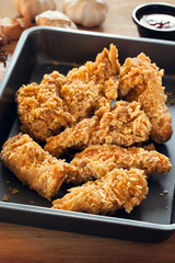 fried chicken in black tray
