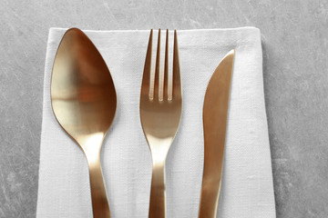 Table setting with cutlery and napkin, closeup