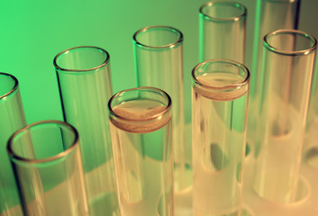 Test tubes on light green background