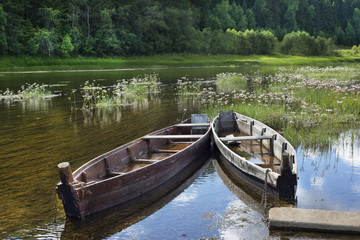 Fototapeta na wymiar Boats on river at beautiful summer day