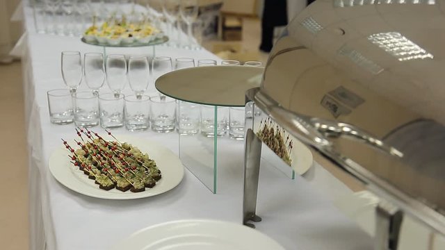 Close-up view of banquet table served with canape and appetizers.